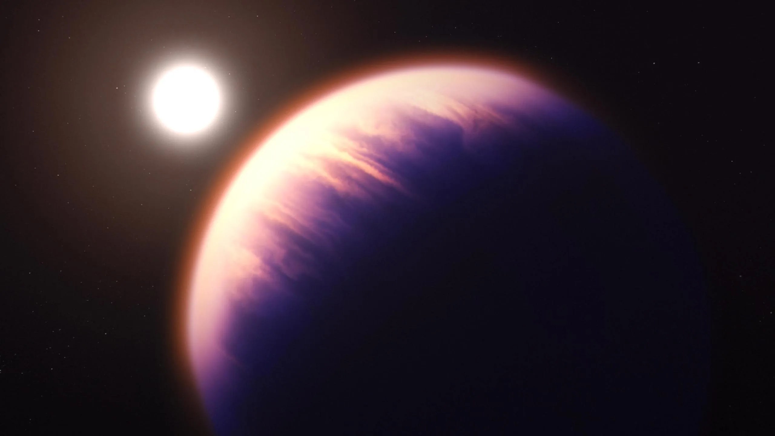 Esta ilustración muestra el aspecto que podría tener el exoplaneta WASP-39 b, según nuestro conocimiento actual del planeta. WASP-39 b aparece en primer plano parcialmente iluminado por su estrella anfitriona, que se ve más pequeña a la distancia, en la mitad superior izquierda de la imagen. El exoplaneta se ve en tonos de lila y rosado. WASP-39 b es un planeta gigante gaseoso, inflado y caliente. La estrella, WASP-39, es un poco más pequeña y menos masiva que el Sol.