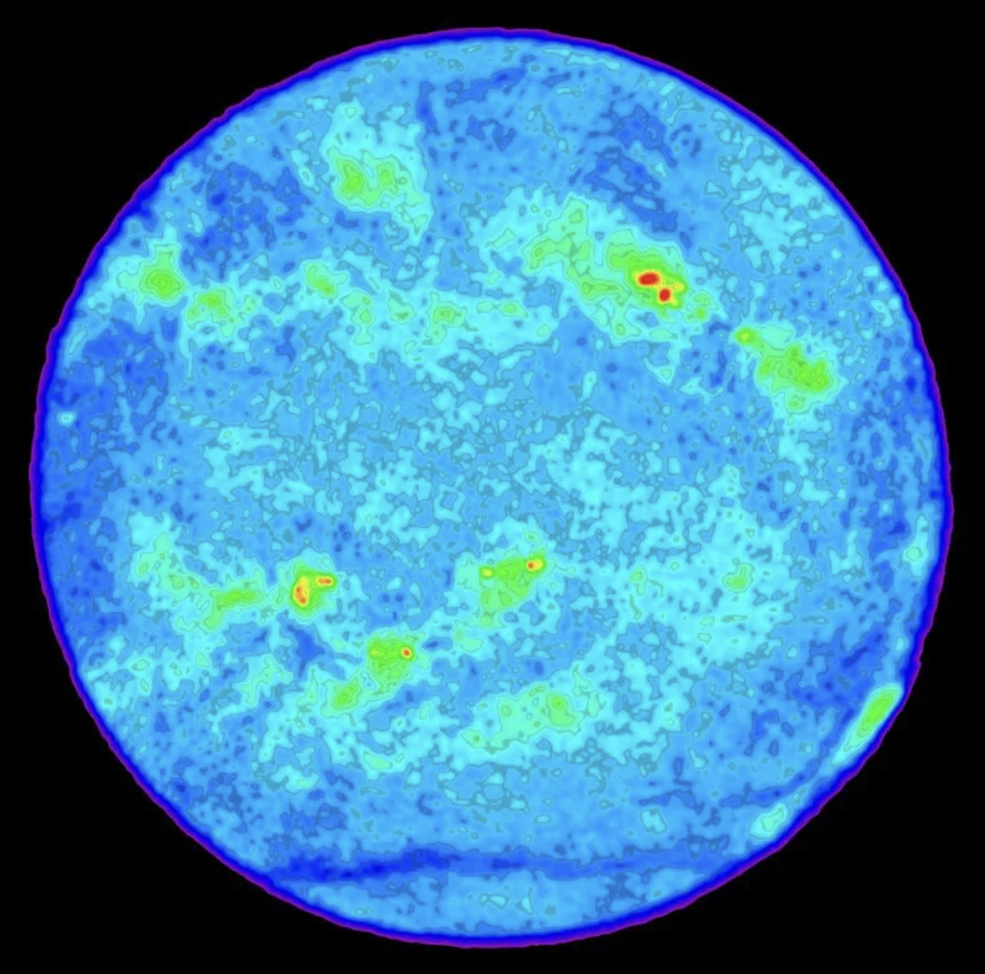 Esta imagen de radio del Sol fue hecha con un radiotelescopio. Muestra regiones brillantes (en rojo y amarillo) de gas a millones de grados de temperatura, por encima de las manchas solares.