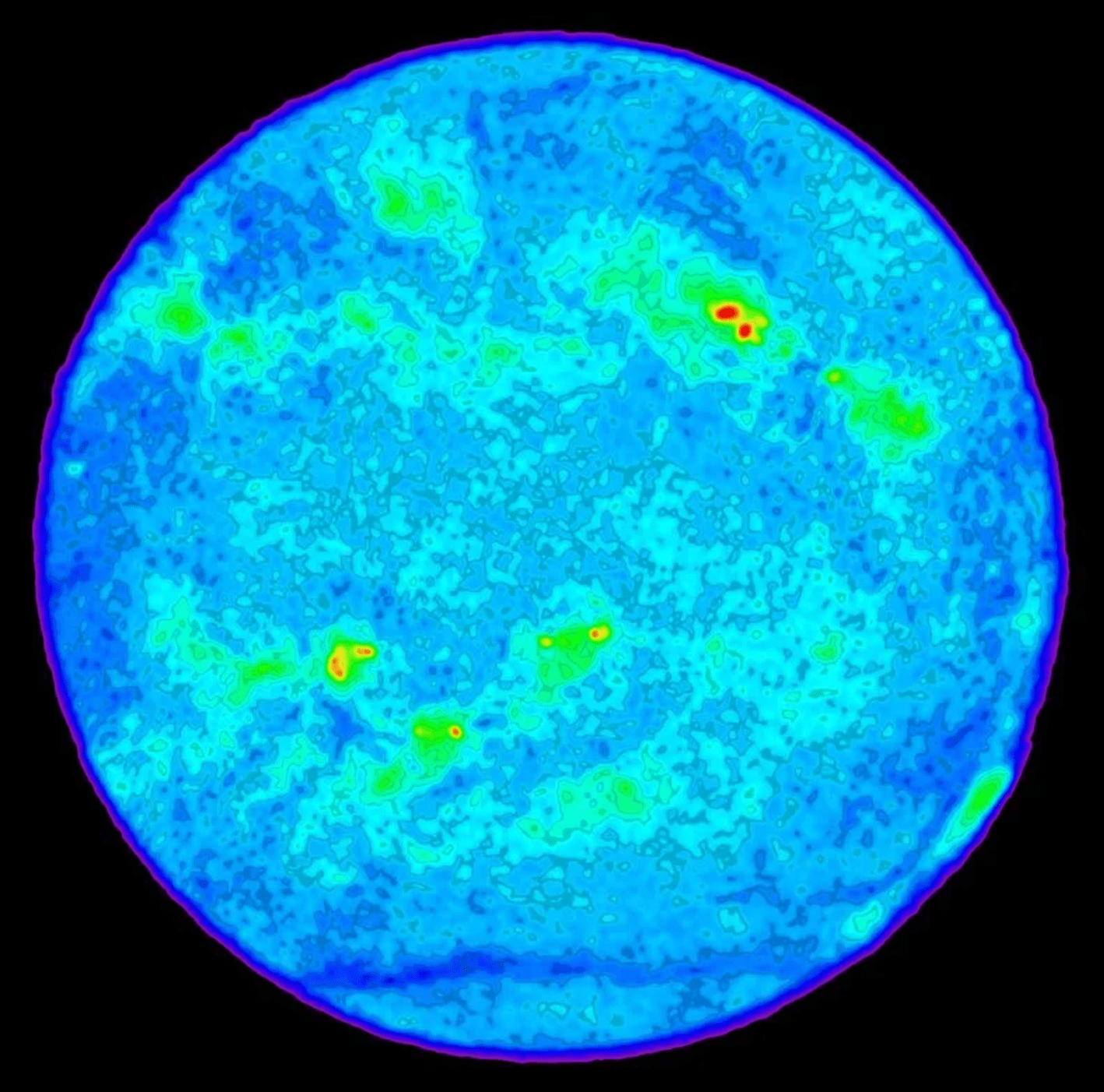 Esta imagen de radio del Sol fue hecha con un radiotelescopio. Muestra regiones brillantes (en rojo y amarillo) de gas a millones de grados de temperatura, por encima de las manchas solares.