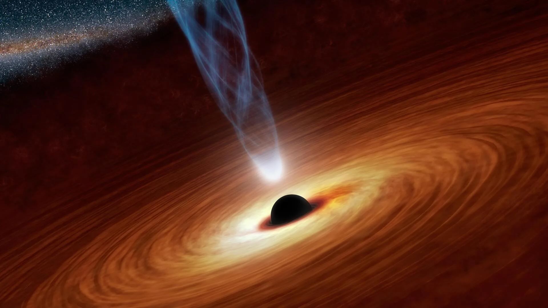 Esta ilustración muestra un agujero negro supermasivo con millones o miles de millones de veces la masa de nuestro Sol. Los agujeros negros supermasivos son objetos enormemente densos enterrados en el corazón de las galaxias.