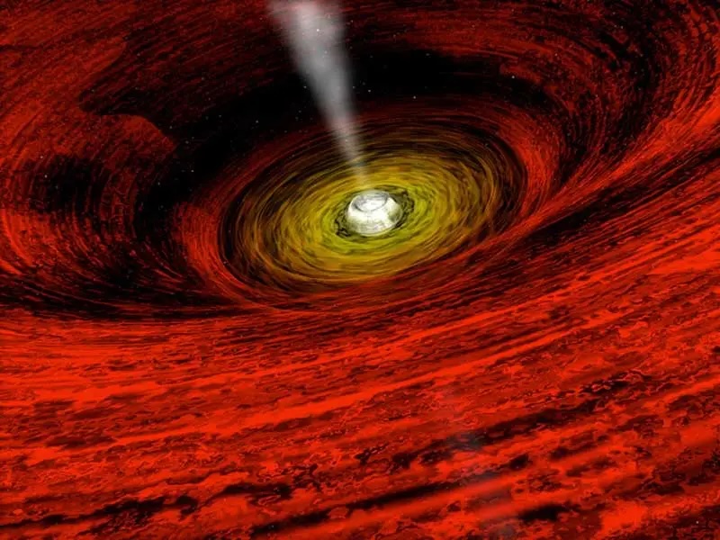 Esta animación ilustra la actividad que ocurre alrededor de un agujero negro. Si bien no se puede ver la materia que ha pasado el horizonte de sucesos del agujero negro, el material que se arremolina fuera de este umbral se acelera a millones de grados y se irradia en luz de rayos X.